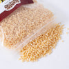 Clear resealable bag spilling small natural beeswax pellets, ideal for handcrafted candle making, featured in lamps and lighting, candlemaking supplies, and best sellers collections.