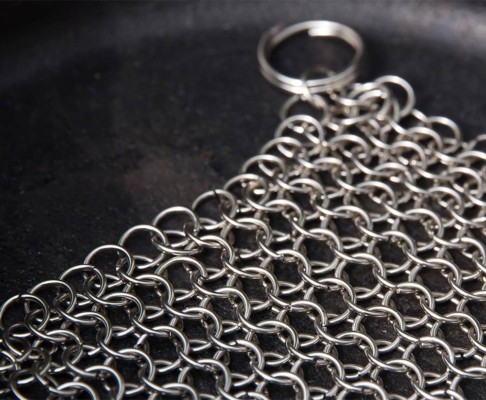 Stainless steel chainmail cleaner designed for scrubbing cast and wrought iron cookware, handcrafted and featured in Home & Decor, Household Cleaning, and Cleaning Utensils collections.