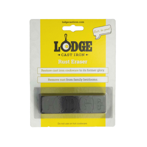 Rectangular rust eraser bar embossed with "LODGE" in clear packaging with yellow and white backing, designed for restoring cast iron cookware, featured in Kitchen & Food and Household Cleaning collections.