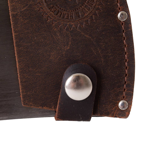 Close-up of a handcrafted dark brown leather axe sheath with a silver snap button and reinforced stitching, designed for durability in farm and garden tool use.