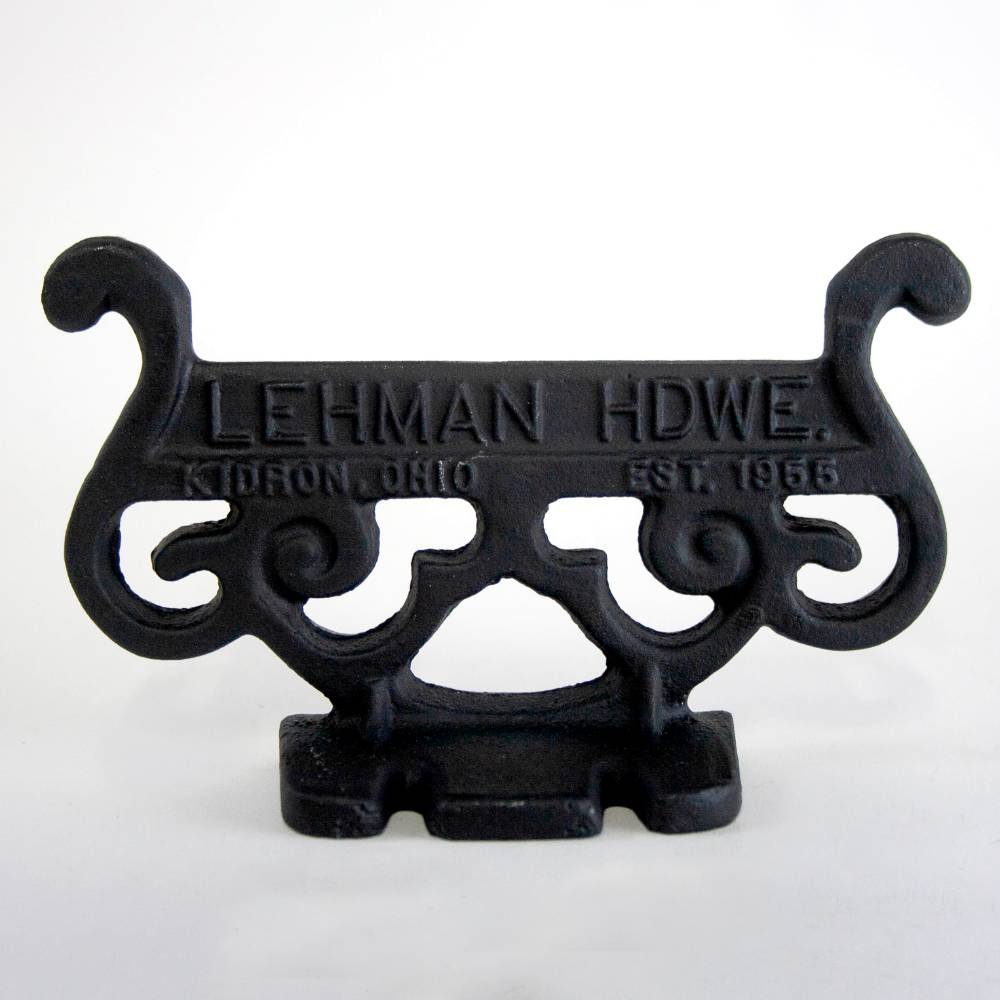 Handcrafted glossy black cast aluminum boot scraper with vintage scroll design, Amish made in USA, durable and rustproof, ideal for Home & Decor, Household Helpers, and Best Sellers collections.