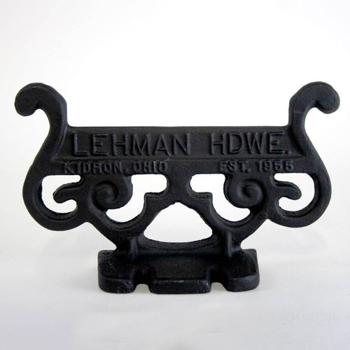 Handcrafted glossy black cast aluminum boot scraper with vintage scroll design, Amish made in USA, durable and rustproof, ideal for Home & Decor, Household Helpers, and Best Sellers collections.