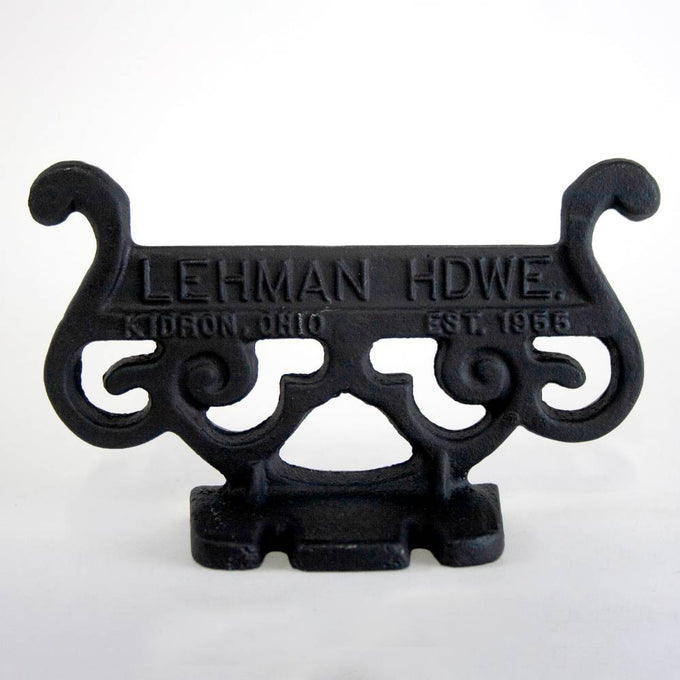 Handcrafted glossy black cast aluminum boot scraper with vintage scroll design, Amish made in USA, durable and rustproof, ideal for Home & Decor, Household Helpers, and Best Sellers collections.