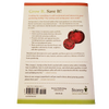 Back cover of a garden how-to book featuring tips on saving and growing seeds, with a tomato illustration and publisher information, ideal for books and home gardening collections.
