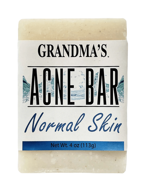 Handcrafted acne soap bar labeled for normal skin, featuring soothing ingredients, designed to help clear blemishes, part of Health & Wellness and Best Sellers collections.