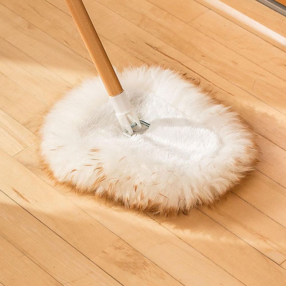 Handcrafted lamb's wool mop head with natural lanolin shown on hardwood floor, designed for dusting and cleaning in Home & Decor and Household Cleaning collections.