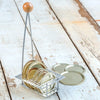 Handcrafted rack with wooden knob handle holds 12 canning lids securely in individual slots, designed for safe steam sterilizing, ideal for kitchen, food preservation, and homesteading collections.