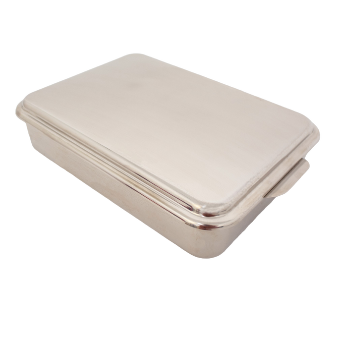 Rectangular stainless steel cake pan with fitted lid, designed for baking and transporting cakes, casseroles, and desserts, featured in kitchen and holiday hosting collections.