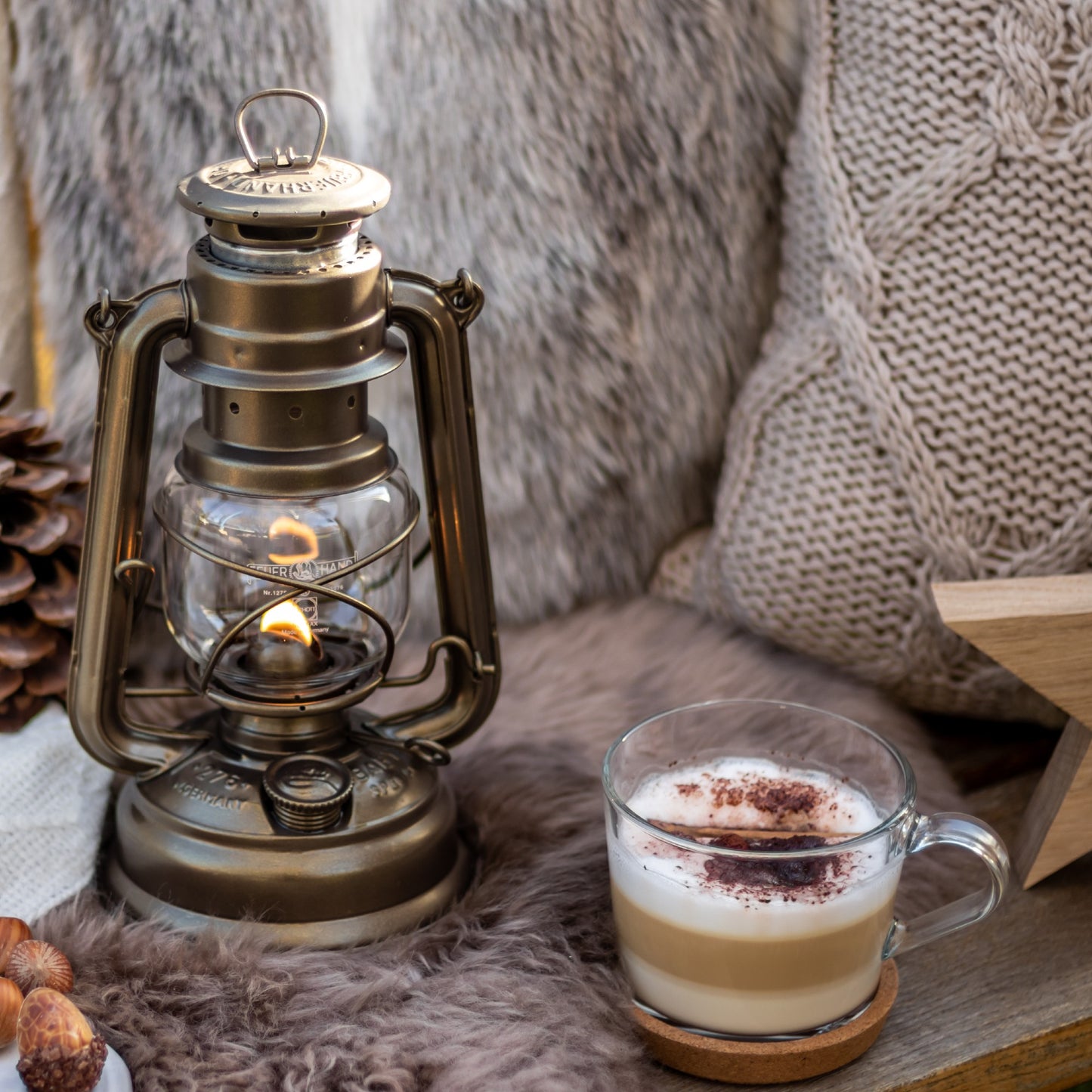 Handcrafted galvanized oil lantern with heat-resistant SUPRAX globe, providing warm, reliable light for camping, emergency supplies, and cozy outdoor or barn settings.