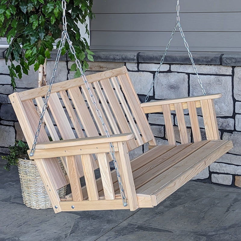 Handcrafted hanging porch swing made from low-maintenance cypress wood with slatted back and seat, suspended by sturdy metal chains, perfect for outdoor furniture and home decor collections.