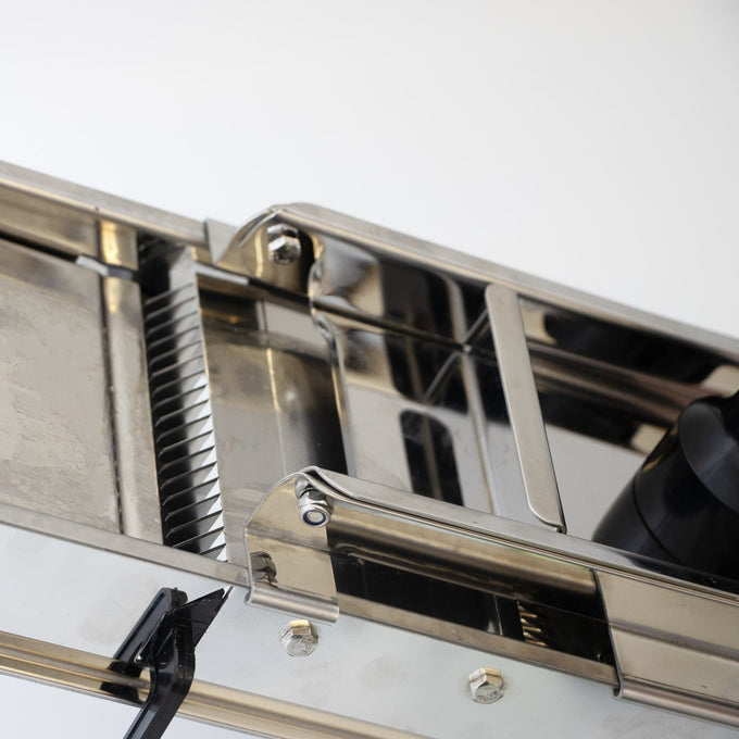 Stainless steel kitchen mandoline veggie slicer with built-in straight and crinkle-cut blades, designed for efficient food prep, featured in Kitchen & Food and Food Prep collections.