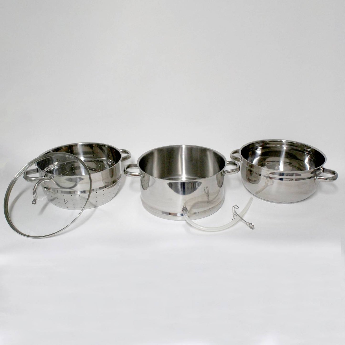Three-piece stainless steel steam juicer set with clear glass lid and leak-proof spout, designed for stovetop use and featured in Kitchen & Food, Juicers and Steamers, and Best Sellers collections.