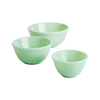 Set of three handcrafted pale green glass mixing bowls in varying sizes, ideal for kitchen and food prep, USA made and featured in Cookware, Baking Supplies, Dinnerware, and Best Sellers collections.