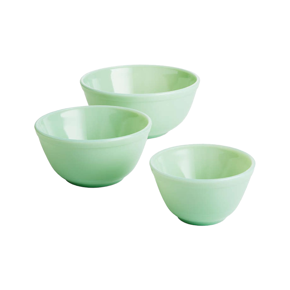 Set of three handcrafted pale green glass mixing bowls in varying sizes, ideal for kitchen and food prep, USA made and featured in Cookware, Baking Supplies, Dinnerware, and Best Sellers collections.