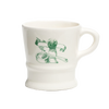 White porcelain shaving mug with vintage-style green illustration of shaving brush, soap, and straight razor, featured in Health & Wellness, Grooming and Personal Hygiene collections.
