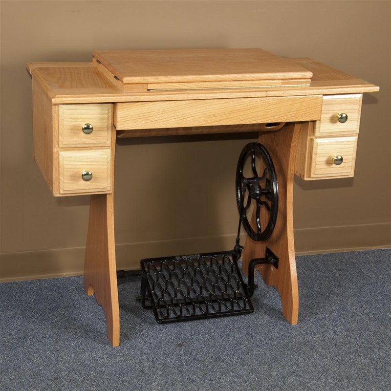 Handcrafted solid oak sewing cabinet with black iron treadle, featuring beveled edges and honey finish, ideal for indoor furniture, sewing and quilting, and Amish-made USA collections.