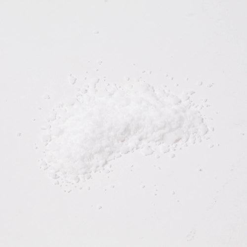Small pile of fine white stearic acid flakes used in candlemaking to strengthen and harden wax, featured in Health & Wellness, Candlemaking Supplies, and Best Sellers collections.