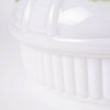 Close-up of a handcrafted white glass lamp shade with soft, textured ridges, designed for use in lamps and lighting, featuring elegant Alpine Meadow decor details.