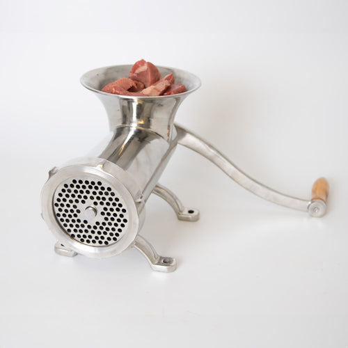 Handcrafted stainless steel kitchen meat grinder with wooden handle, loaded with fresh meat, designed for secure mounting, featured in Kitchen & Food, Specialty Equipment, Butchering Supplies, Best Sellers, Promo Eligible collections.