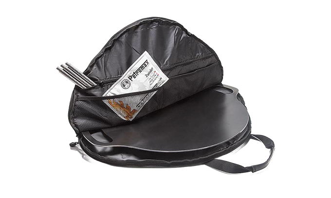 Black durable transport bag unzipped to reveal a flat griddle and metal tools inside mesh pockets, designed for safe carrying and storage in Farm, Garden & Tool and Camping collections.