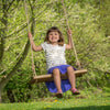 Young girl joyfully swinging on a handcrafted wooden rectangle-style tree swing in a sunny outdoor setting, part of USA Made and Children's Toys collections.