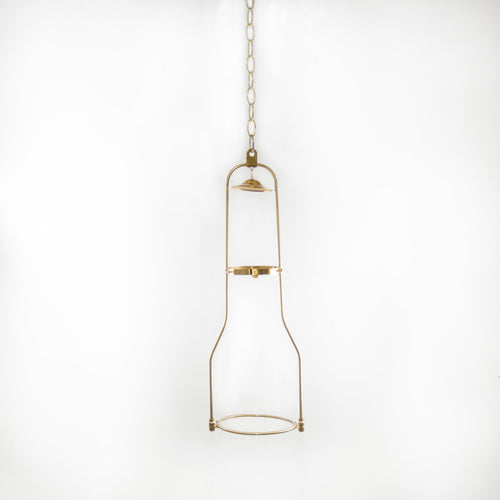 Solid brass hanging bracket designed for oil lamps, showcasing a vintage-inspired frame suspended by a chain, ideal for lamps and lighting collections.