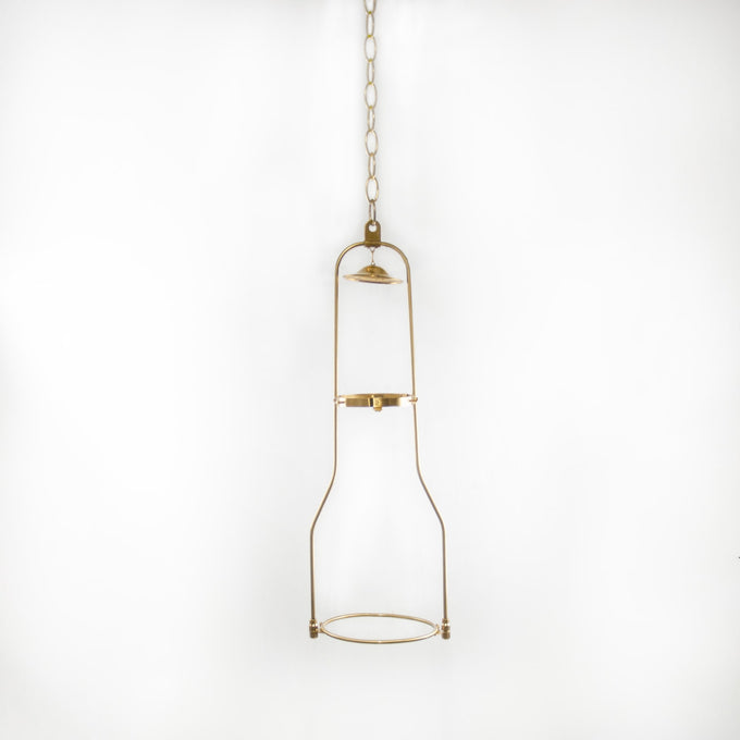 Solid brass hanging bracket designed for oil lamps, showcasing a vintage-inspired frame suspended by a chain, ideal for lamps and lighting collections.