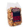 Clear bag of handcrafted caramel popcorn mixed with festive red and white peppermint candies and milk chocolate pieces, perfect for Kitchen & Food, Snacks and Sweets, Popcorn, Best Sellers, and Promo Eligible collections.