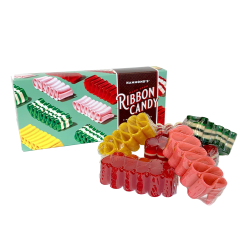 Assortment of handspun ribbon candy in various flavors and colors displayed next to a festive gift box, part of USA Made Snacks and Sweets collections.