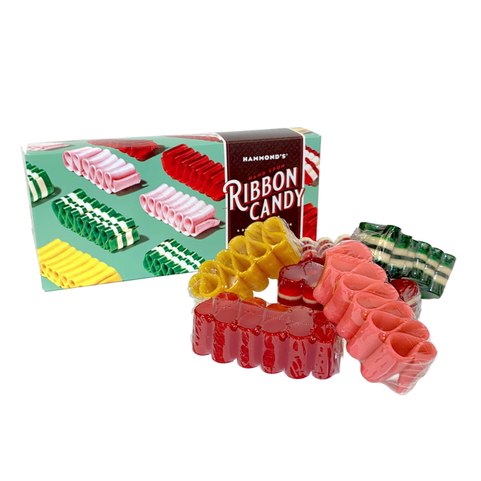Assortment of handspun ribbon candy in various flavors and colors displayed next to a festive gift box, part of USA Made Snacks and Sweets collections.
