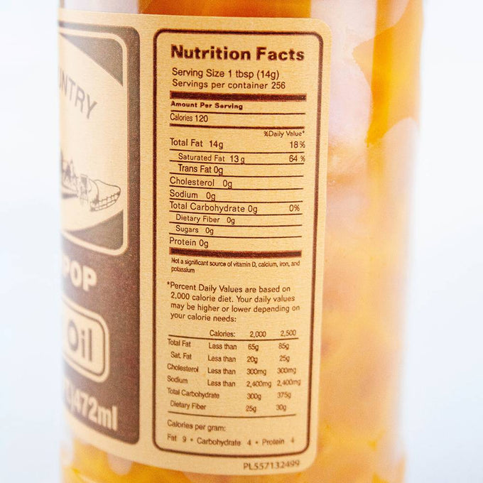 Close-up of nutrition facts label on a handcrafted, made in USA popcorn coconut oil container highlighting 120 calories per serving and zero carbohydrates, ideal for Kitchen & Food and Snacks collections.