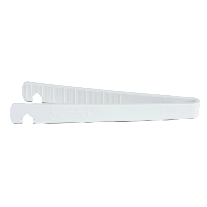White silicone toaster tongs with serrated teeth and integrated oven rack hook, designed for safe heat handling in Kitchen & Food, Kitchen Gadgets, and Cooking and Baking Helpers collections.
