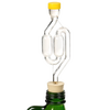 Clear glass S-shaped airlock with yellow cap and cork stopper set in a green bottle neck, designed for fermenting in kitchen, food preservation, and fermenting collections.