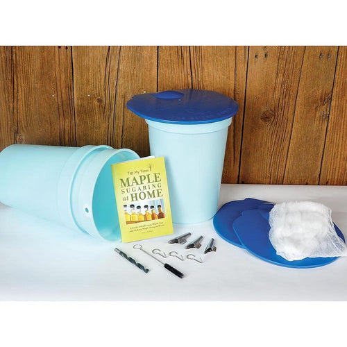 Light blue plastic sap collection buckets with blue lids, metal tapping tools, filter bags, and a maple sugaring instruction booklet, ideal for farm, garden, and maple syrup supplies.