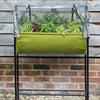 Raised fabric planter with green growing bed suspended on a black metal frame and covered by a clear polyethylene greenhouse top, designed for easy small garden irrigation in Farm, Garden & Tool and Garden Accessories.