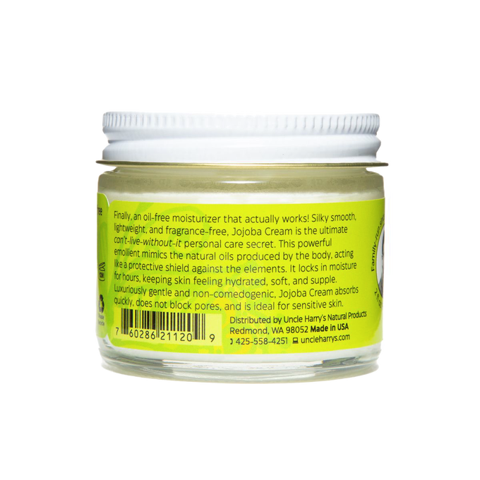 Clear glass jar with white lid showing green product label for Uncle Harry's Jojoba Cream Oil-Free Moisturizer, highlighting gentle, fast-absorbing formula ideal for sensitive skin, made in USA, featured in Health & Wellness and Balms, Creams and Lotions collections.