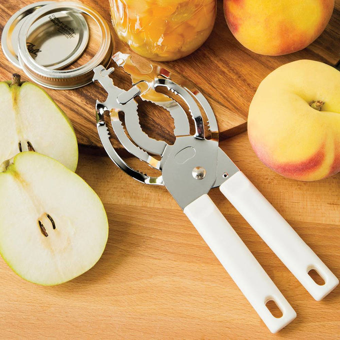 Chrome steel jar and bottle opener with white handles, shown with fruit preserves and fresh peaches and pears, designed for Kitchen & Food, Kitchen Gadgets, and Best Sellers collections.