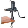Compact cast iron wheatgrass juicer with black Xylon finish, hand-crank, and clamp base attached to a wooden surface, ideal for Kitchen & Food and USA Made collections.