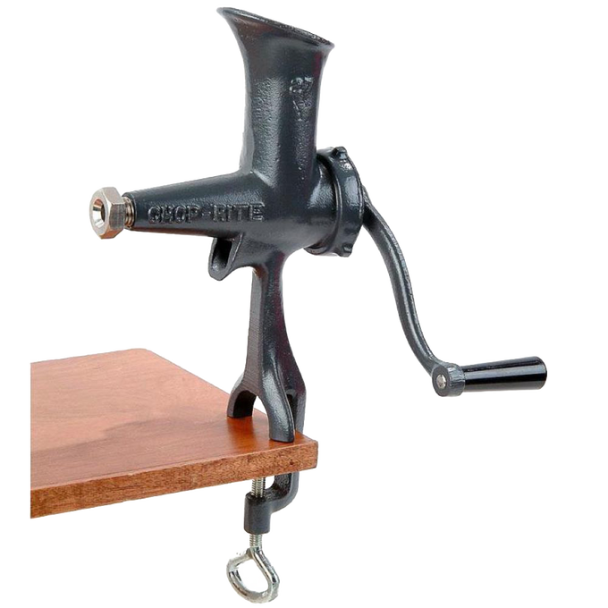 Compact cast iron wheatgrass juicer with black Xylon finish, hand-crank, and clamp base attached to a wooden surface, ideal for Kitchen & Food and USA Made collections.