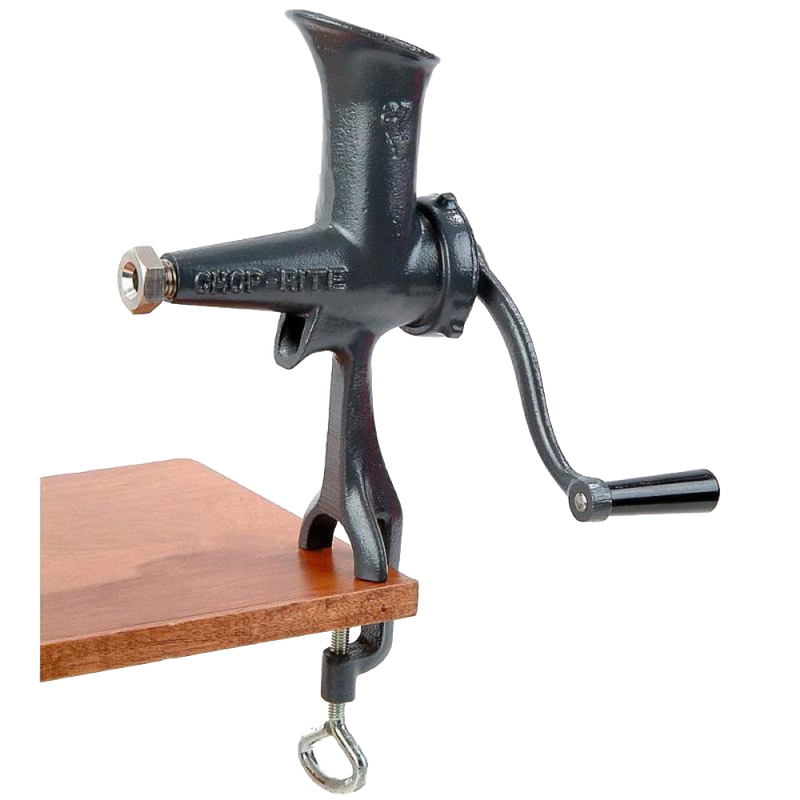 Compact cast iron wheatgrass juicer with black Xylon finish, hand-crank, and clamp base attached to a wooden surface, ideal for Kitchen & Food and USA Made collections.
