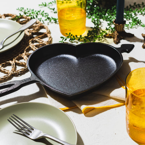 Handcrafted cast iron skillet in a heart shape with arrow detail, made in USA, perfect for unique baking and cooking, ideal for Kitchen & Food, Cookware, Cast Iron, Baking Supplies, Best Sellers, and Promo Eligible collections.