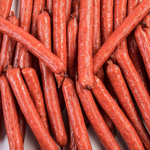 Close-up of handcrafted hickory smoked snack sticks made from pork and beef, offering a savory, flavorful option for Kitchen & Food, Snacks and Sweets, Meats, USA Made, Best Sellers, and Promo Eligible collections.