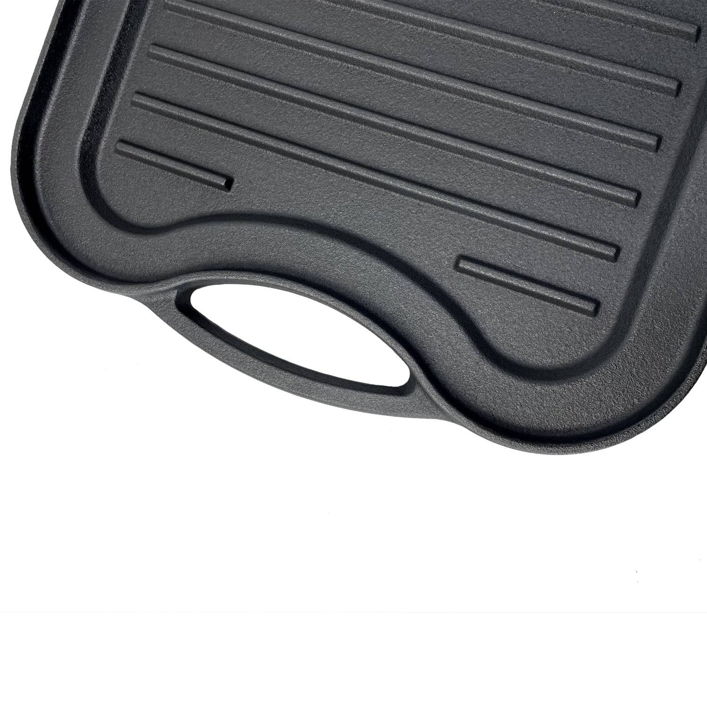 Close-up of nitrogen hardened cast iron griddle with ribbed surface and ergonomic handle, handcrafted for reliable grilling in Kitchen & Food and Cast Iron cookware collections.