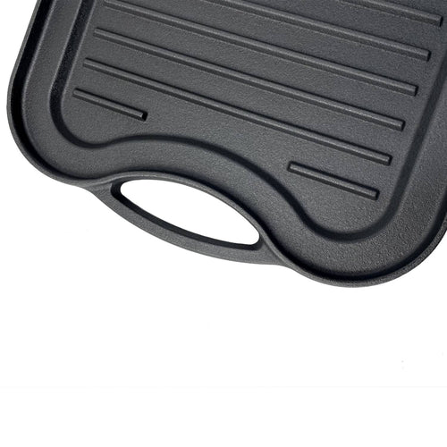 Close-up of nitrogen hardened cast iron griddle with ribbed surface and ergonomic handle, handcrafted for reliable grilling in Kitchen & Food and Cast Iron cookware collections.