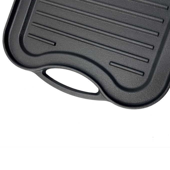Close-up of nitrogen hardened cast iron griddle with ribbed surface and ergonomic handle, handcrafted for reliable grilling in Kitchen & Food and Cast Iron cookware collections.