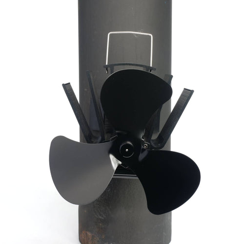 Black three-bladed magnetic fan mounted on a stove flue pipe, designed to circulate warm air efficiently, featured in Stoves, Hearth Accessories, Best Sellers, and Promo Eligible collections.