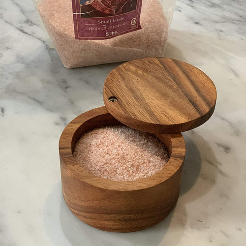 Handcrafted acacia wood salt cellar with a swivel lid, filled with pink Himalayan salt, ideal for Kitchen & Food, Storage and Serving, and Best Sellers collections.