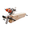 Portable orange and silver chainsaw milling setup with guide rails clamped to a large wooden log, designed for precise plank cutting in wood cutting and hauling tasks.