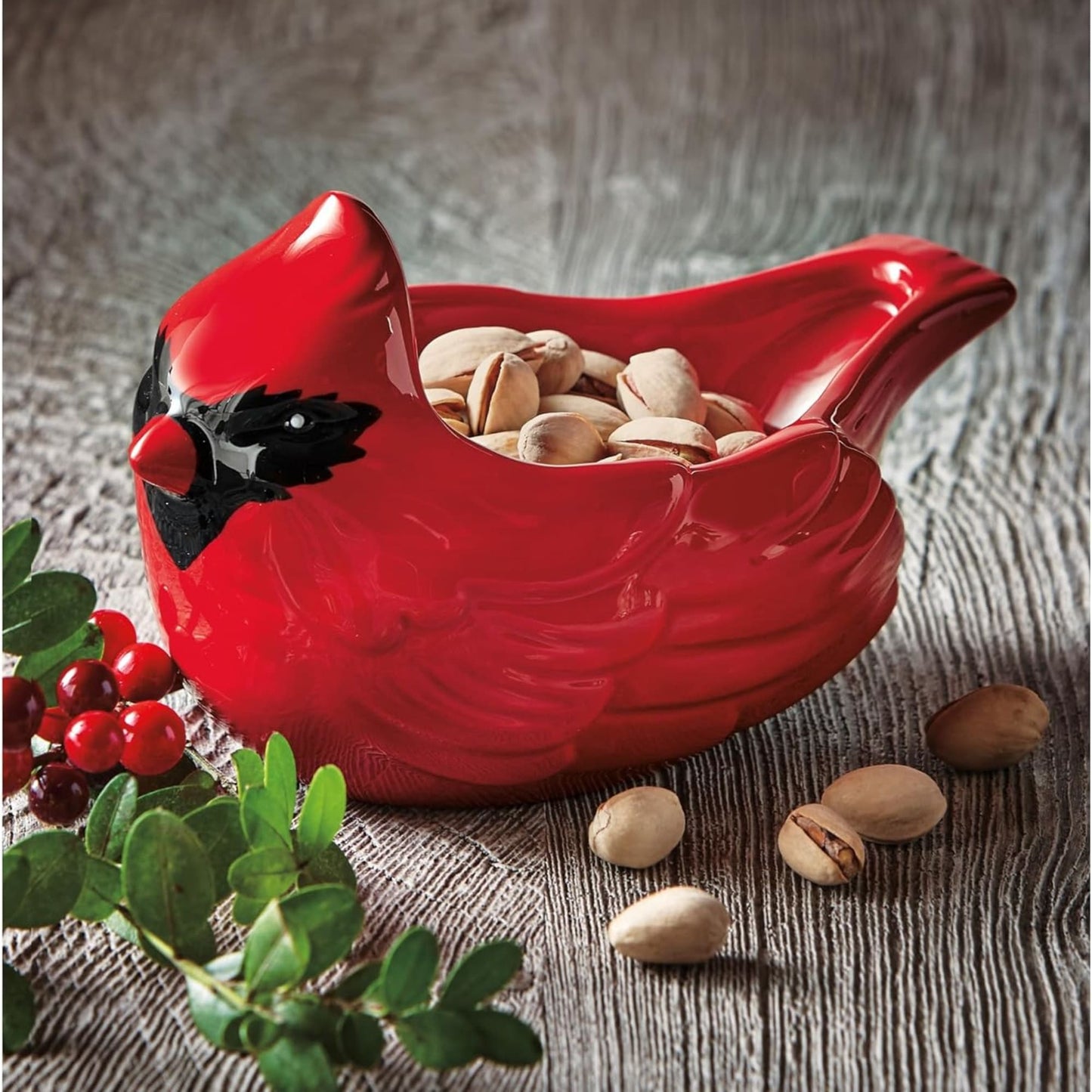 Handcrafted ceramic bowl shaped like a red cardinal holding pistachios, perfect for holiday decor and entertaining, featured in Home & Decor, Kitchen & Food, and Dinnerware collections.
