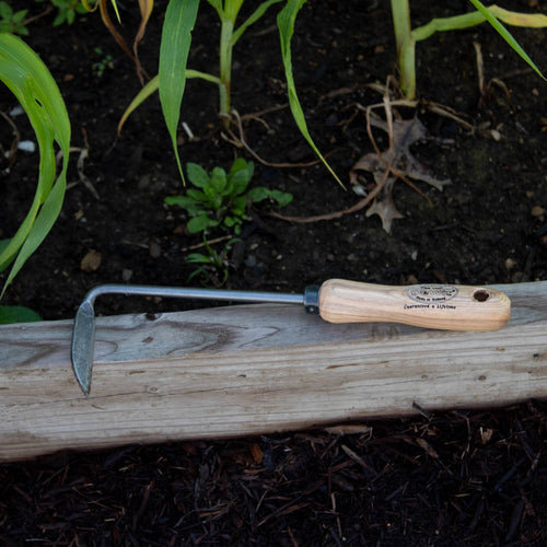 Handcrafted DeWit Cape Cod hand weeder with short wooden handle and durable metal blade, designed for easy maneuvering and precise weed removal in tight garden spaces, featured in Farm, Garden & Tool and Digging and Cultivating collections.